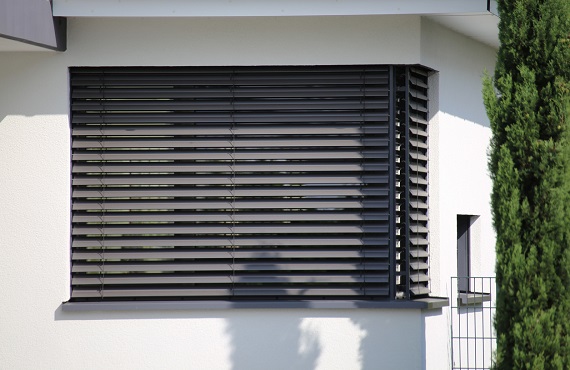 Window with modern blind with white wall combination