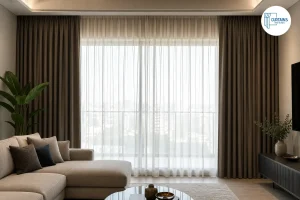 Layered sheer and blackout curtains in a living room
